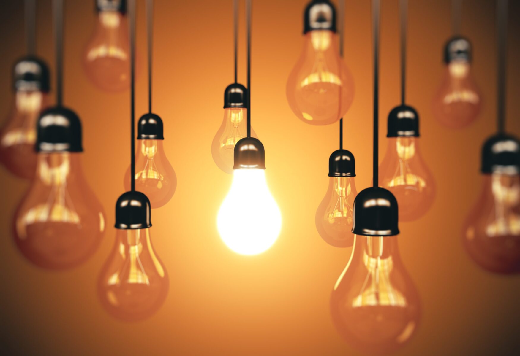 Many light bulbs hanging the wire and one glows. Business idea concept. 3d rendering