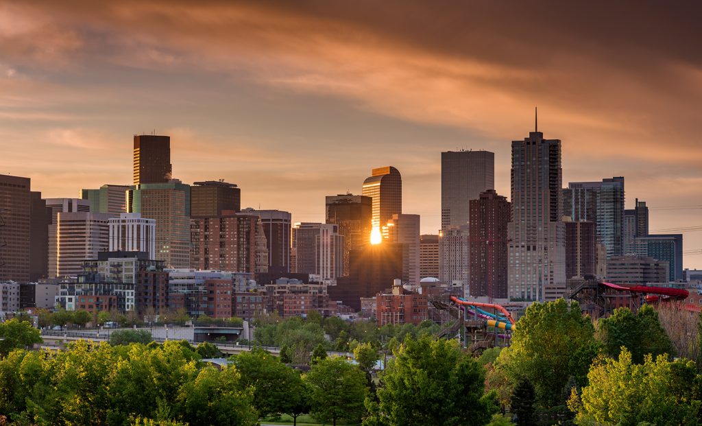 Denver Colorado skyline with sun star reflection