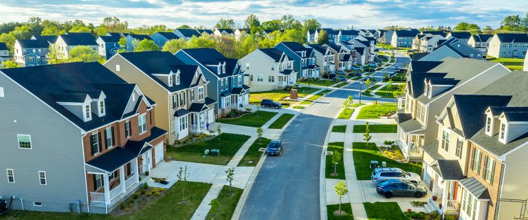 Aerial view of classic upper middle class neighborhood street.