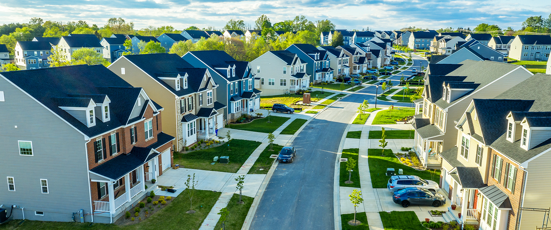 Aerial view of classic upper middle neighborhood street.