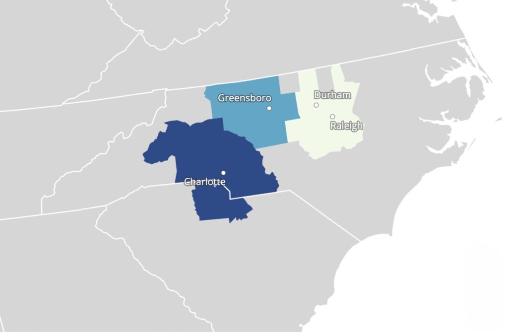 Map of North Carolina highlighting three major metro areas: Charlotte, Greensboro, and the Raleigh–Durham region. City names are labeled near each shaded area, and surrounding state boundaries and roads are shown in light gray for context.